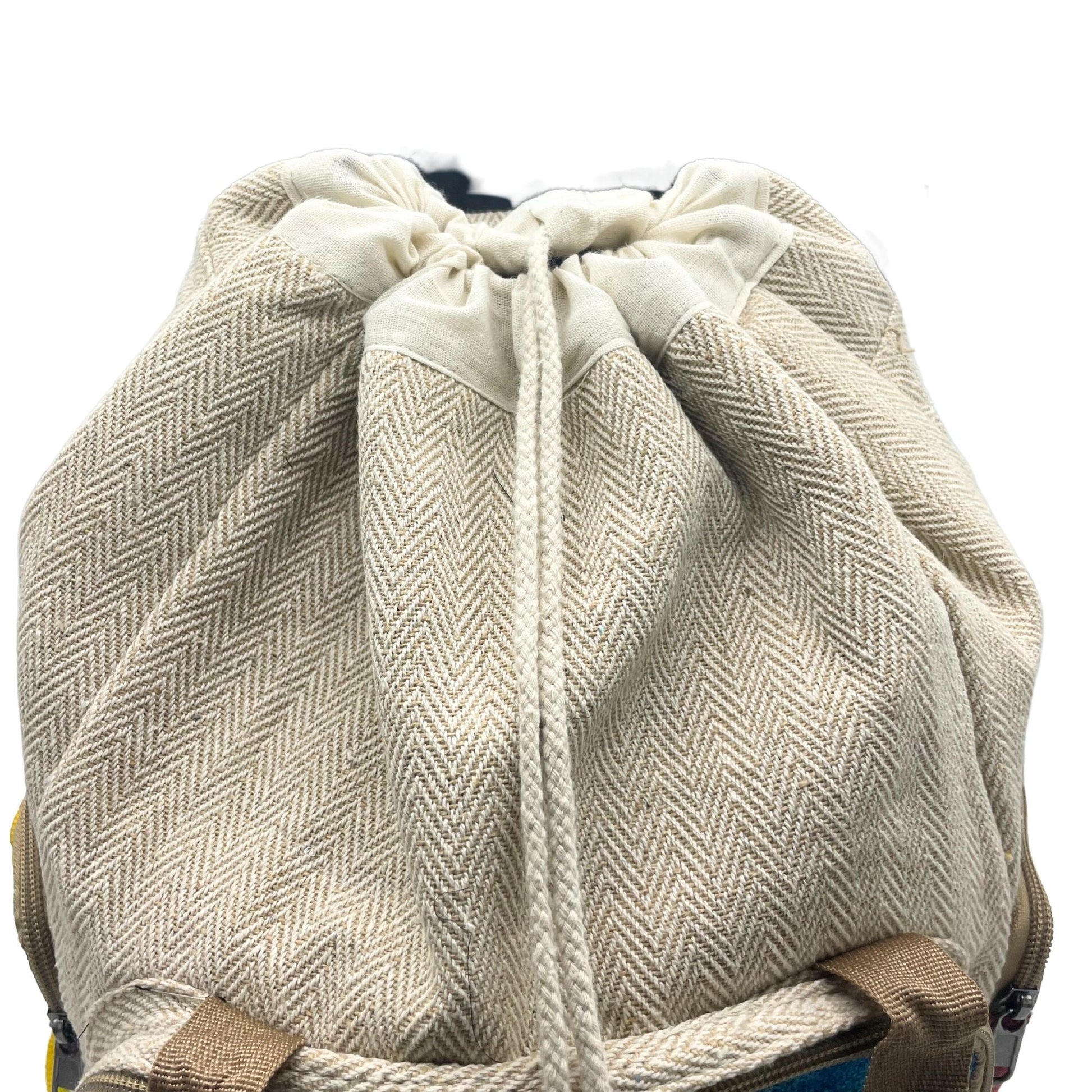 Tiedye Hemp Large Square Backpack in natural hemp-cotton fabric with herringbone texture and drawstring closure, close-up view