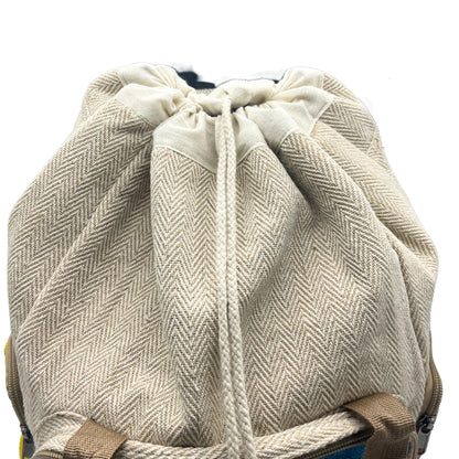 Tiedye Hemp Large Square Backpack in natural hemp-cotton fabric with herringbone texture and drawstring closure, close-up view