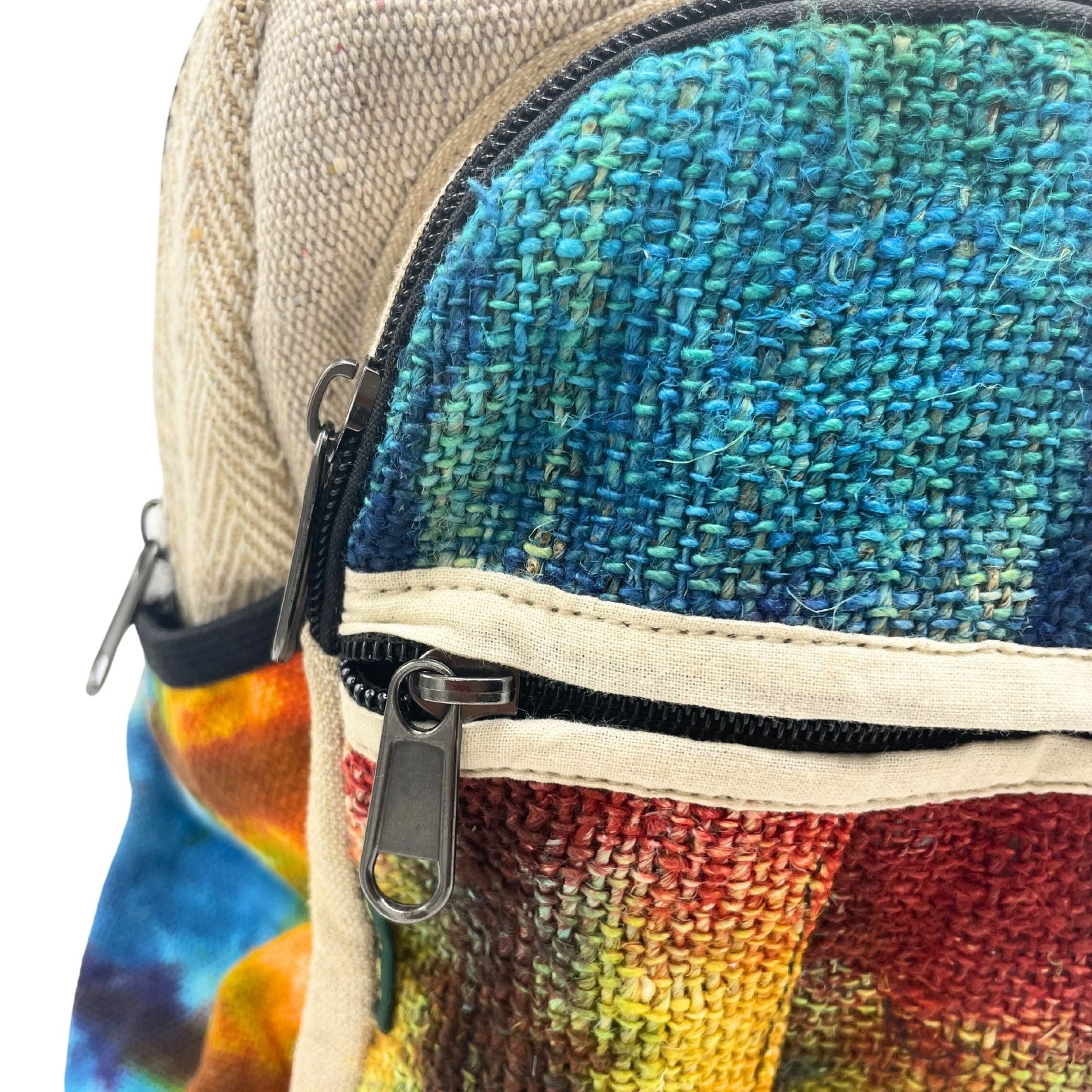 Alt Tag: Tiedye Hemp Medium Size Backpack – No Print close-up of hemp-cotton fabric, tie-dye colors, and front zipper pocket