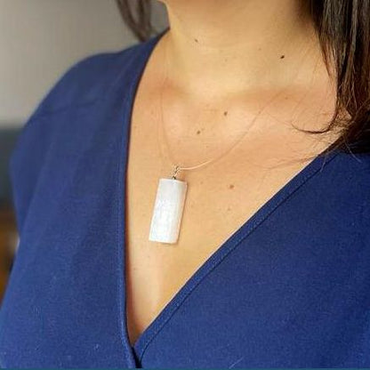 Alt Tag: Translucent Selenite Pendant Necklace – 5x1.5 CM worn on a silver chain, rectangular translucent selenite pendant close-up