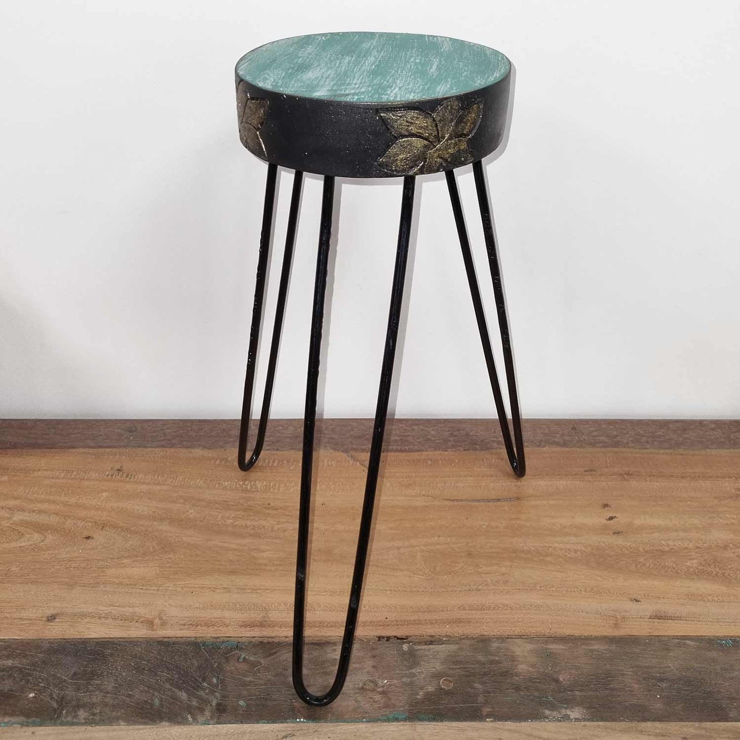 Alt Tag: Turquoise Albasia Wood Plant Stand – Gold Detail turquoise round top with gold accents on black hairpin legs