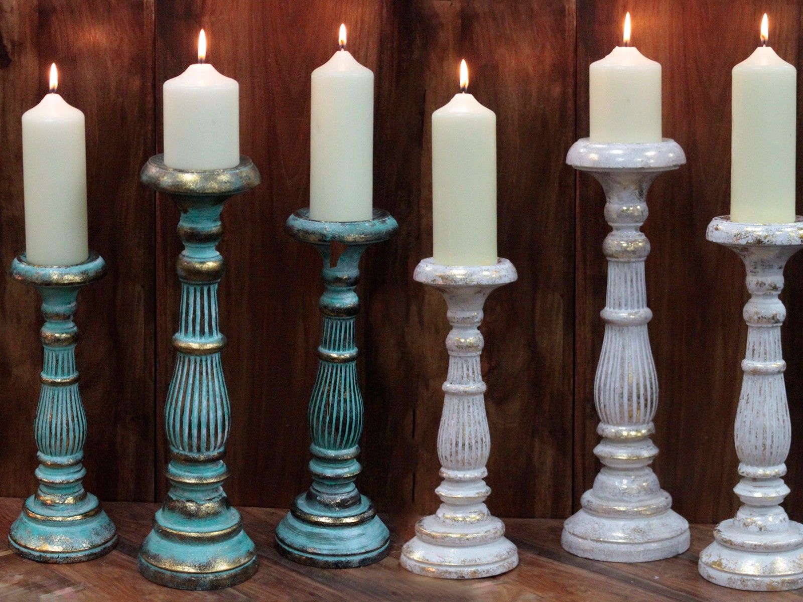 Turquoise Gold Large Candle Stand – Decorative Metal tall candle holders with lit white pillar candles on wooden background