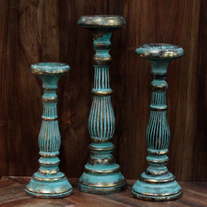 Turquoise Gold Medium Candle Stand – Decorative Metal set of three distressed turquoise and gold metal candle holders on wood background
