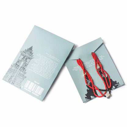 Unconditional Love Temple String Bracelet – Red Heart red string bracelet with metal beads, shown on product card packaging