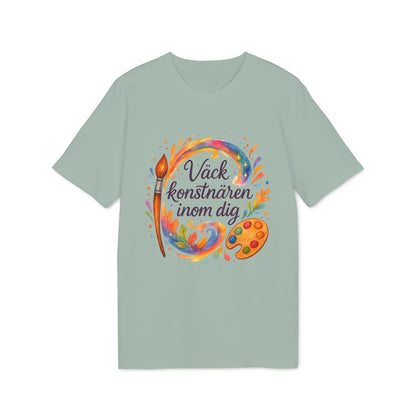 Väck Konstnären Inom Dig Waldorf Sustainable Unisex Tee med akvarellmotiv av pensel, färgstänk och målarpalett på grön t-shirt