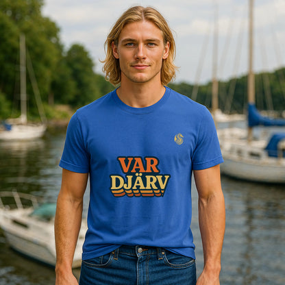 Var Djärv Ungdom 100% Organic Cotton T-Shirt blue graphic tee worn by model at marina waterfront