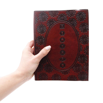 Vegetable Tanned Leather Notebook – Medium, Tibetan Mandala red embossed leather cover notebook held in hand, front view