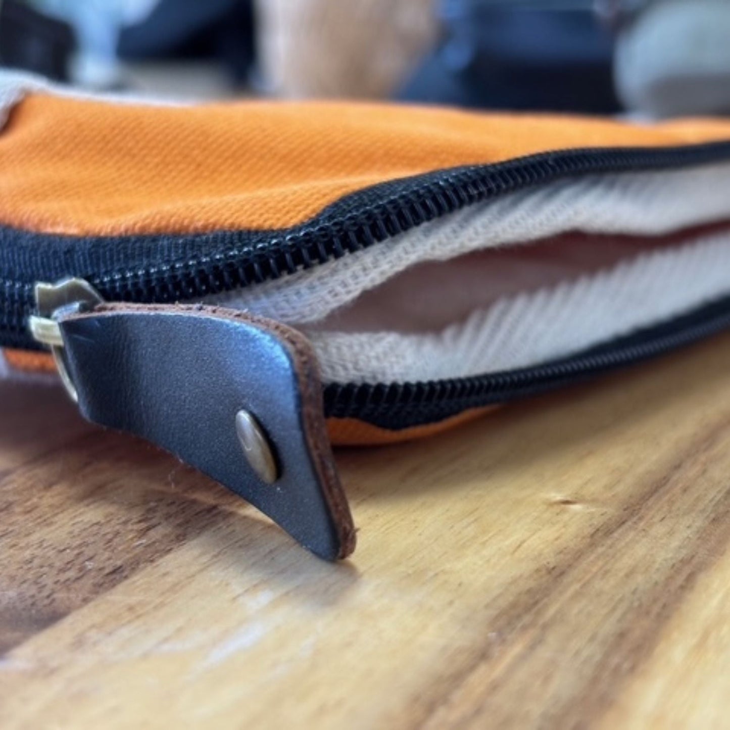 Vibrant Orange Canvas Laptop Pouch – 24x33 CM close-up of orange canvas pouch with zipper and leather pull tab