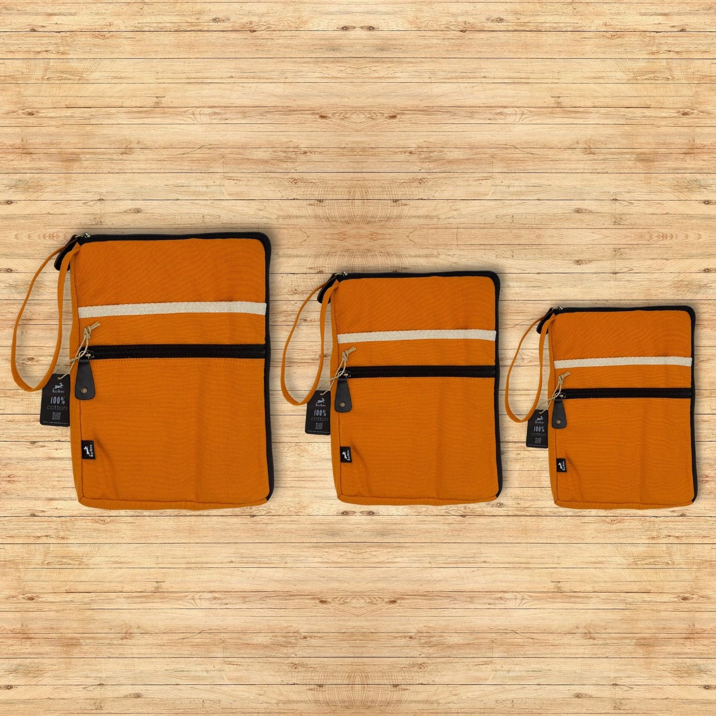 Vibrant Orange Canvas Laptop Pouch – 24x33 CM, orange canvas zip laptop sleeve with wrist strap and front pocket on wooden background