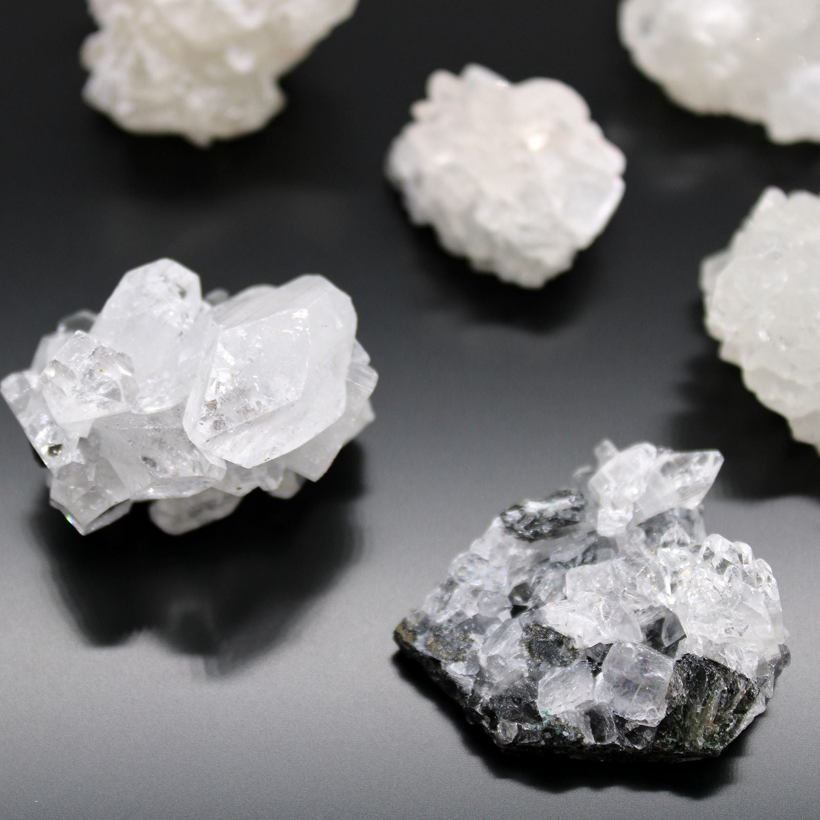 Alt Tag: White Apophyllite Clusters – 20–30 MM natural white crystal cluster specimens on black background, close-up product photo