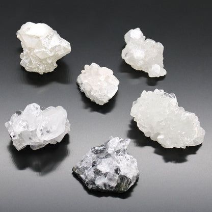 Alt Tag: White Apophyllite Clusters – 20–30 MM natural white crystal clusters on dark background, small raw mineral specimens