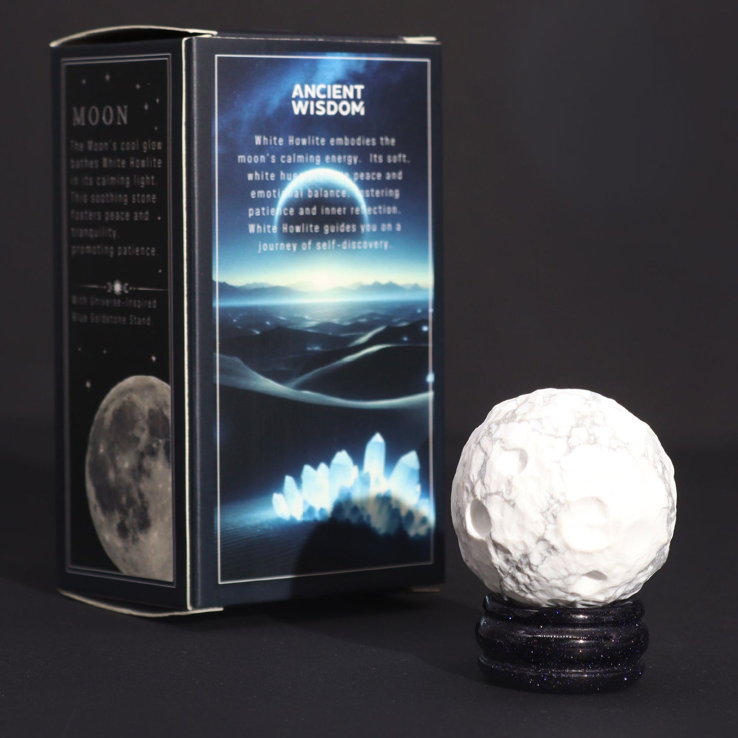 White Howlite Gemstone Planet – 40MM Solar Goldstone Stand with cratered white sphere on sparkling dark stand beside product box