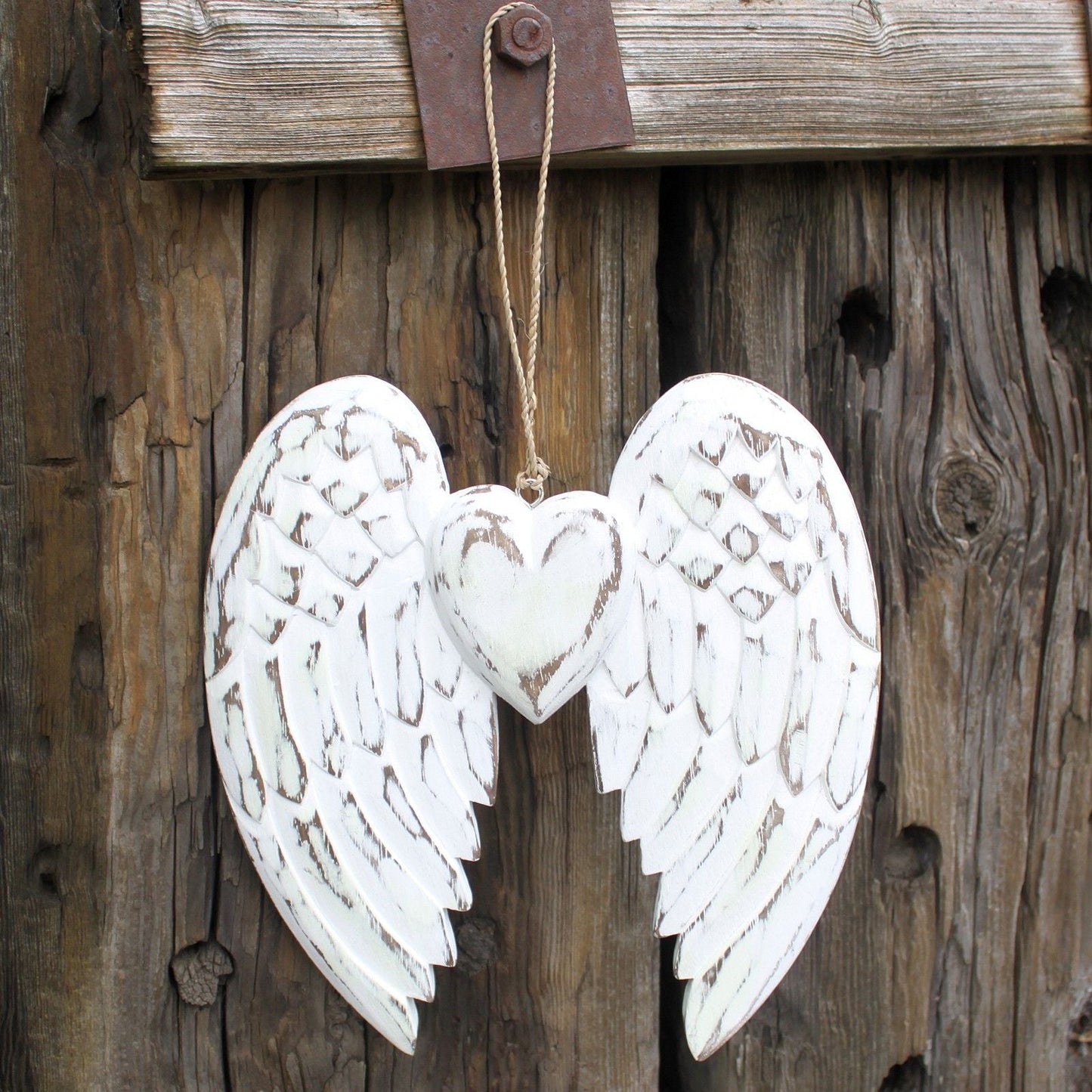 Alt Tag: White Washed Angel Wings – 24CM Heart Design hand carved whitewashed albesia wood wall decor hanging on rustic wood door