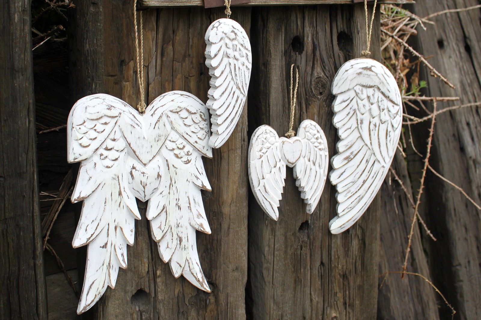 White Washed Angel Wings – 31CM hanging white-washed carved wooden angel wing wall decor set on rustic wood background