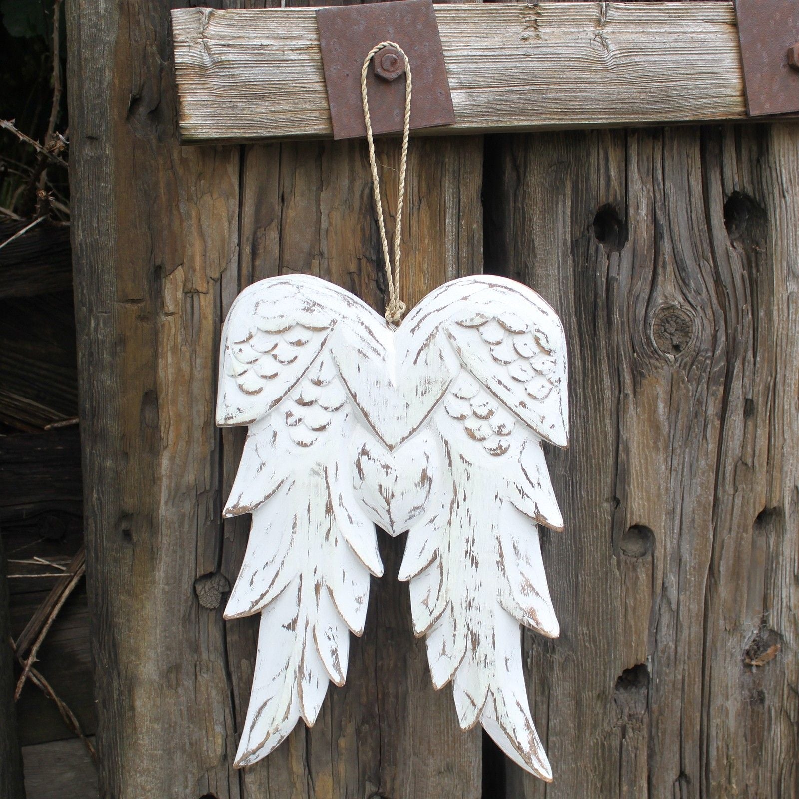 Alt Tag: White Washed Angel Wings – 31CM double angel wing wall decor in white-washed wood, hanging on rustic wooden door