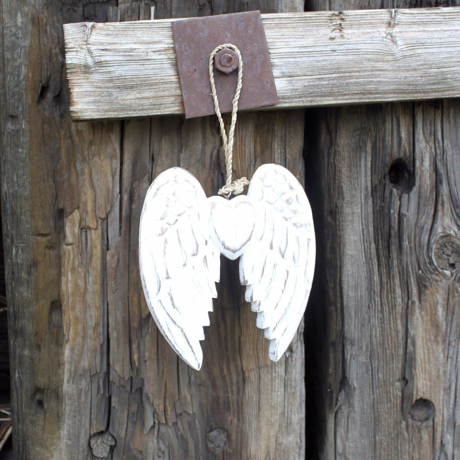 White Washed Angel Wings – Heart Decoration 15CM hanging whitewashed carved wood angel wing heart ornament on rustic wooden wall