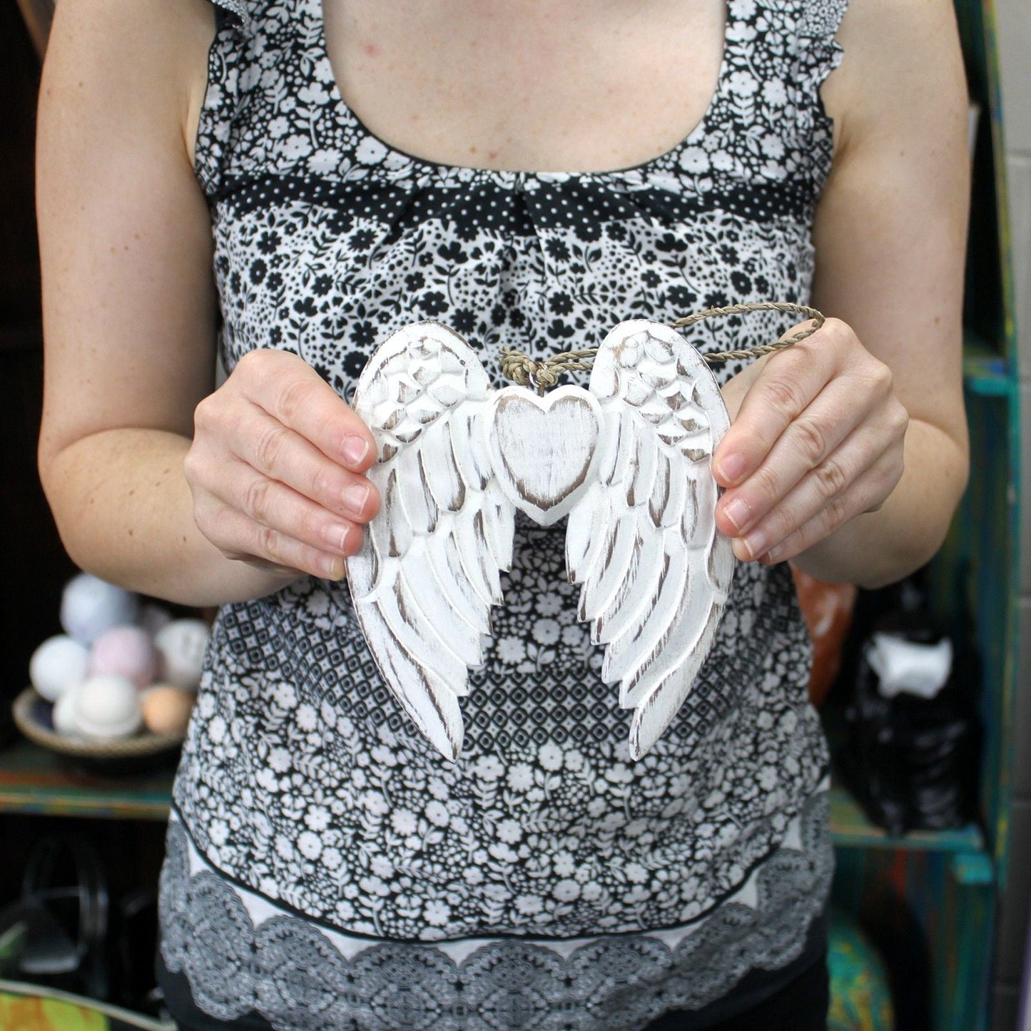Alt Tag: White Washed Angel Wings – Heart Decoration 15CM handcrafted white washed wooden angel wings with heart, held in hands