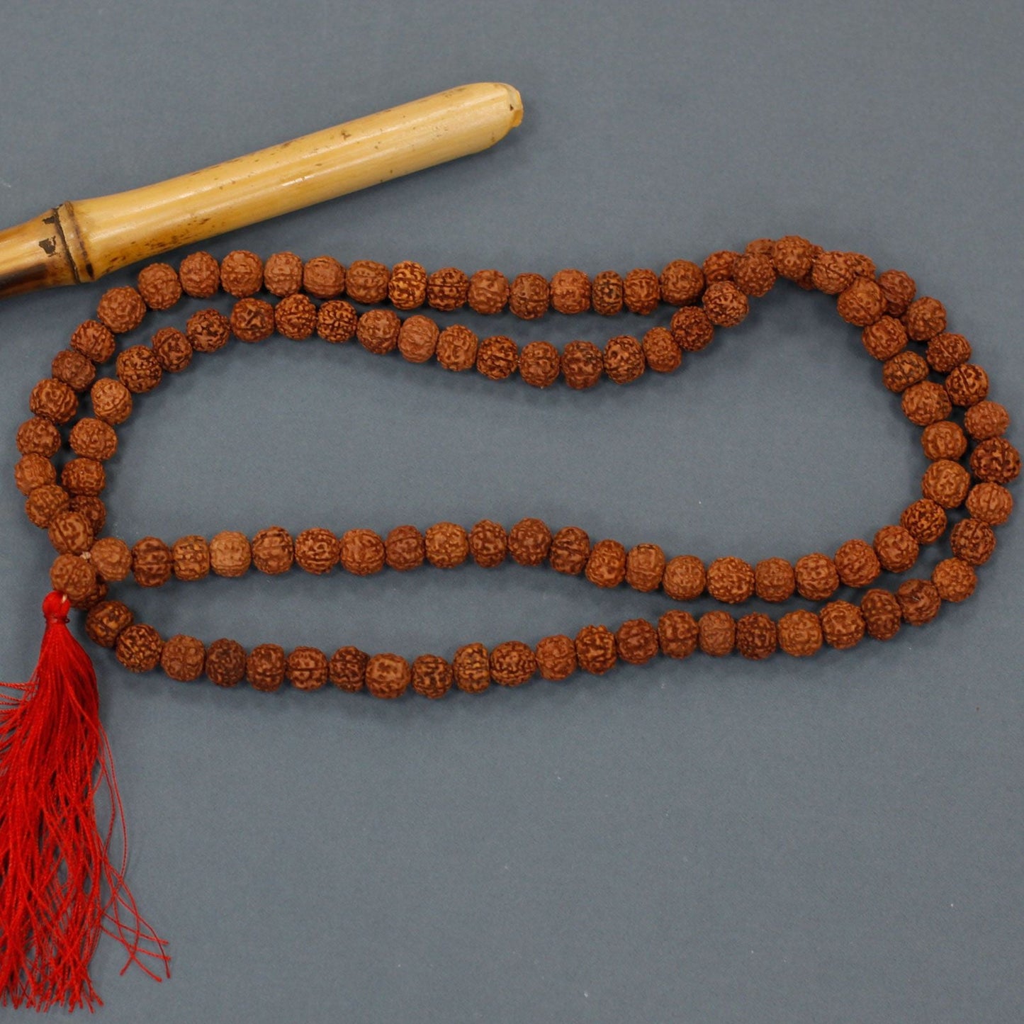 Alt Tag: Wood Bead Rudraksha Mala – 65 CM handcrafted rudraksha bead prayer necklace with red tassel