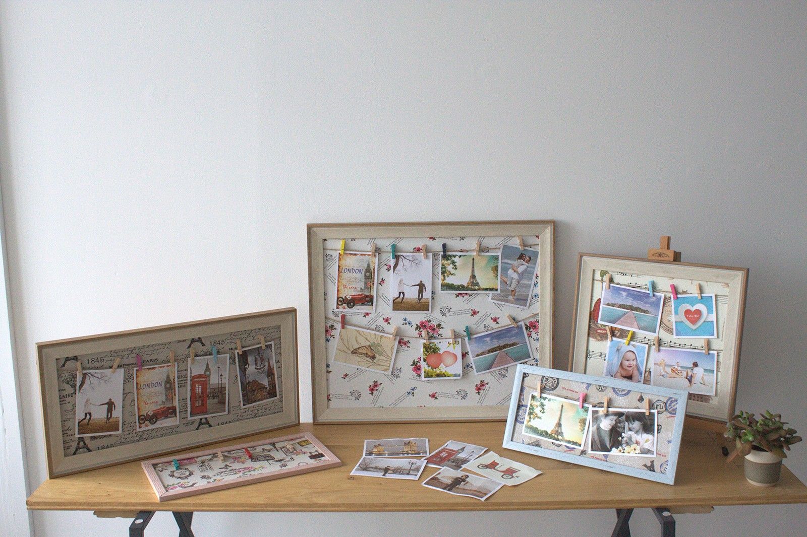 Wooden DIY Peg Photo Frame – 50x60 CM on table with multiple photos clipped, customizable wooden frame display