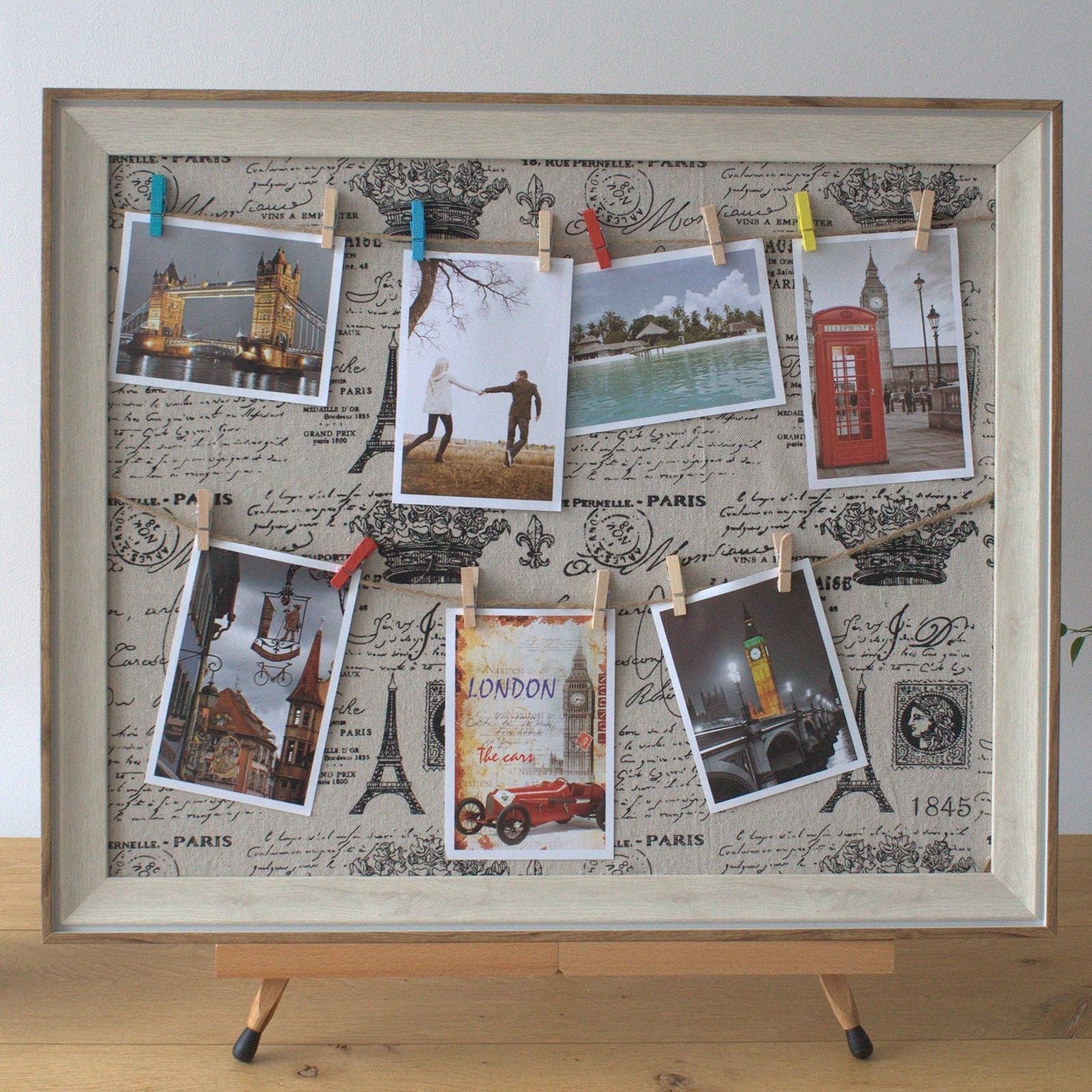 Wooden DIY Peg Photo Frame – Paris, 50x60 CM with textile canvas and mini pegs displaying photos and postcards on Paris-themed background
