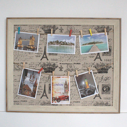 Alt Tag: Wooden DIY Peg Photo Frame – Paris, 50x60 CM with wooden frame, textile canvas and pegs holding photos, postcards and notes