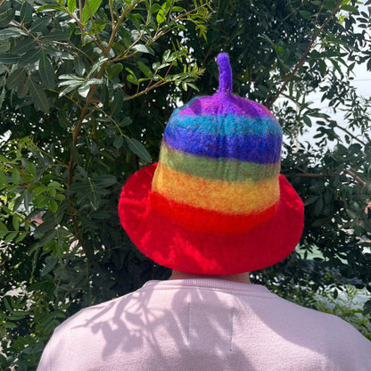 Alt Tag: Wool Felt Sauna Hat – Rainbow 27x34 CM worn from behind, handmade wool felt sauna hat with rainbow stripes and red brim