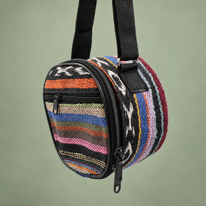 Striped Happy Drum carry bag with a black shoulder strap, perimeter zipper and front pocket.